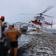 Mission staff loading bait into helicopter buckets on Macquarie Island, which lie halfway between New Zealand and Antarctica.